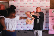 A pupil learns how to deliver a powerful punch.