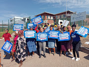 Women opposed to violence against women and children protest outside the Donnybrook magistrate's court on the KZN south coast on Thursday during Baphumelele Zulu's appearance. 