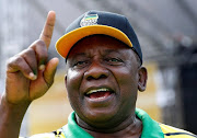 South Africa's Deputy President Cyril Ramaphosa gestures at an election rally of the ruling African National Congress (ANC) in Port Elizabeth, South Africa April 16, 2016. REUTERS/Mike Hutchings/File Photo