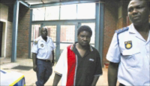 KILLER: Meshack Kharivhe leaves the Limpopo high court after being sentenced for killing his family. 04/04/2009. Pic. Chester Makana. © Sowetan.