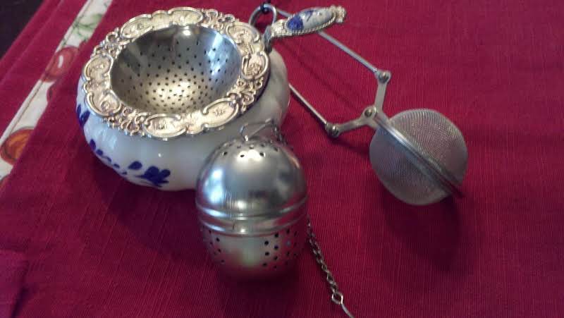 A Tea Strainer And Two Tea Infusers
