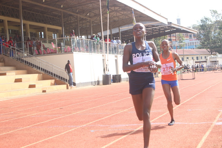 Gladys Kwamboka crosses the finishing line in the in the women's 5,000m