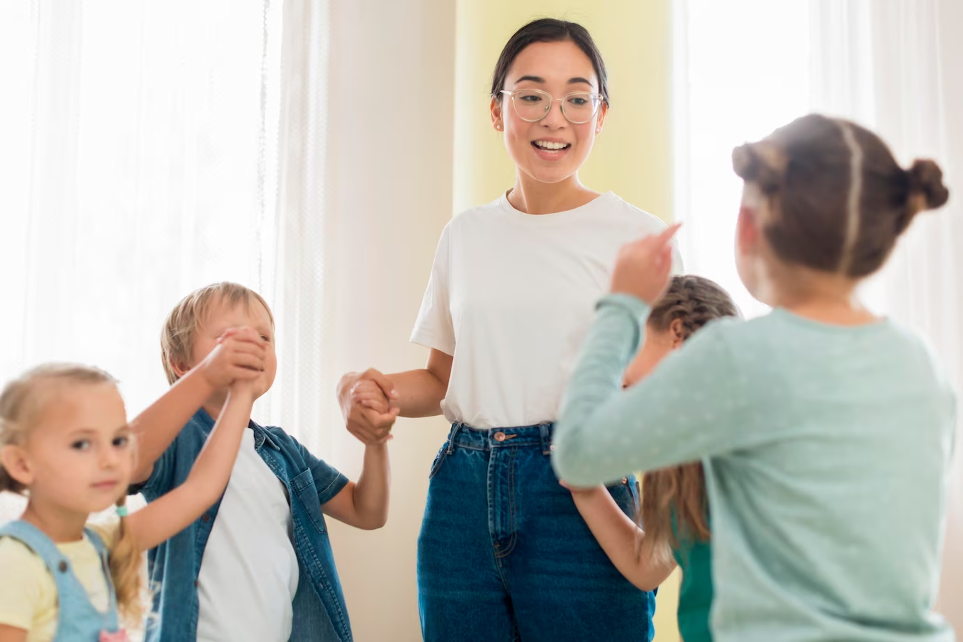 Kids practising voice modulation with their teacher 