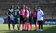 Match officials call off the game between AmaZulu FC and Marumo Gallants FC at King Zwelithini Stadium on November 3 2021 in Durban.