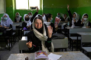 Zinat Karimi, 17, raises her hand during 10th-grade class at the Zarghoona high school on July 25 2021 in Kabul, Afghanistan. File picture