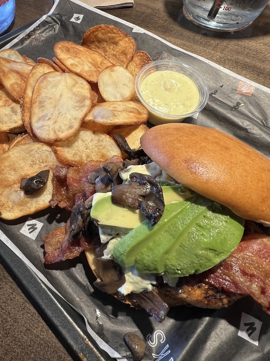 Tom Green grilled chicken burger on GF bun,sub cheese for mushrooms, with kettle chips and side of sonofabeech sauce