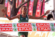 Ethiopian runner Tadu Nare crosses the finish line in the Spar 10km Women's Challenge Grand Prix race in Durban on Saturday.  