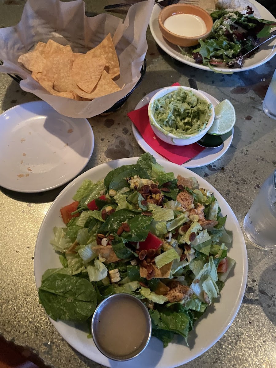 Romaine salad with chicken and chips and guac