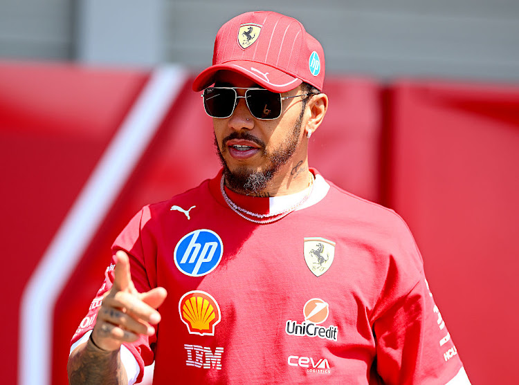 Lewis Hamilton has expressed his total confidence in Ferrari after the Italian Formula One team's double disqualification in China.