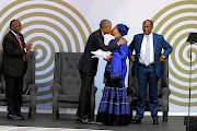 Barack Obama greets Graça Machel at his presentation of the annual Nelson Mandela lecture this week.