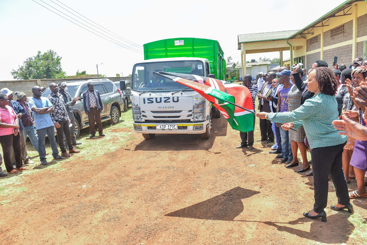 Kirinyaga Governor Anne Waiguru flags off a consignment of animal feed from the county run factory in Kiaga to Kirima Dairy cooperative society