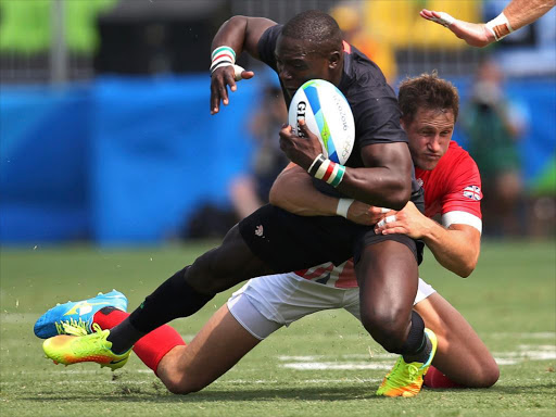 Kenya's Bush Mwale tackled by Great Britain's Mark Robertson in the Men's Pool C rugby match at the Rio games, in Deodoro Stadium, August 9, 2016 /REUTERS