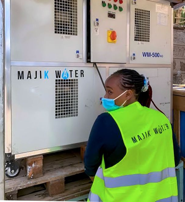 Beth Koigi works on the Majik Water pump