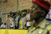 An ANC marshal stands in the foreground as former African Union Commission chairman Nkosazana Dlamini-Zuma greets the audience at the Ben Marais Hall in Rustenburg, North West, where she was to deliver a lecture as part of Israeli Apartheid Week.