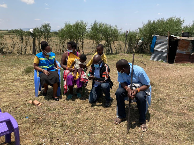 Health ministry workers collect stool samples from all age groups in Narok, not just schoolchildren, to break the chain of community transmission, on September 3.