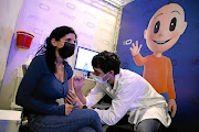 A woman receives a Covid jab at a temporary health-care clinic in Herzliya, Israel. According to Our World in Data, Israel has administered at least one shot to 60% of its population.