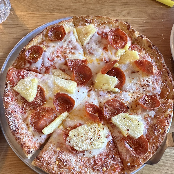 Gluten free pizza with pepperoni and pineapple