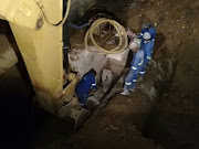 Johannesburg Water employees working on the 'biggest leak' in the city's history.