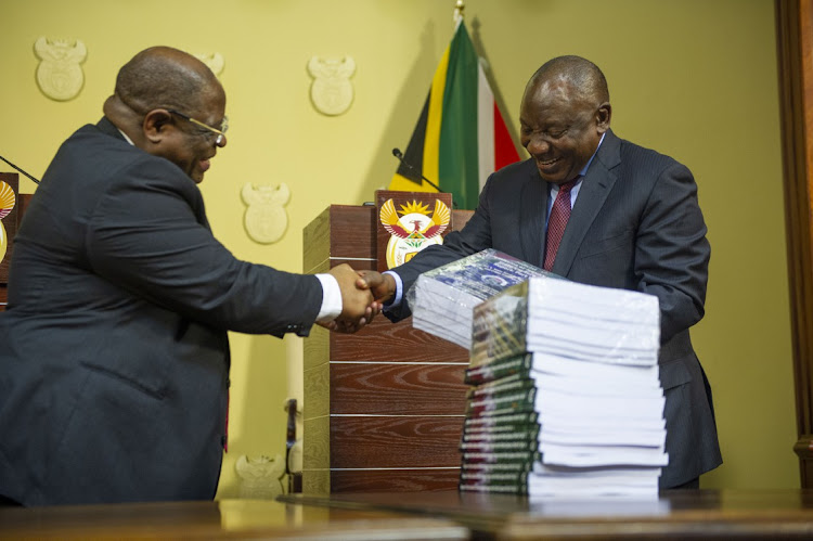 President Cyril Ramaphosa receives the fifth and final state capture report from chief justice Raymond Zondo, left, at the Union Buildings in Pretoria, on June 22 2022. Picture: ALET PRETORIUS/GALLO IMAGES