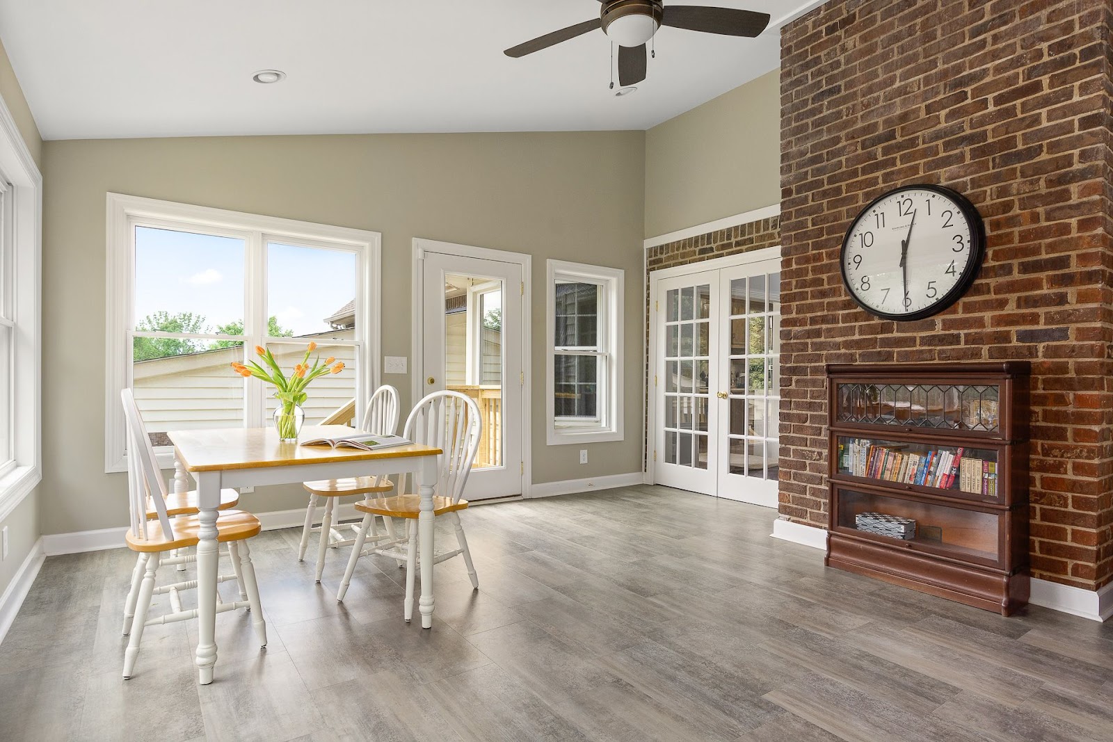 finished sunroom lebanon tennessee brick neutral dining table new flooring remodel 