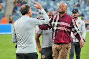 Kaizer Chiefs coach Giovanni Solinas celebrates with the club's football manager Bobby Motaung, after a 1-0 Telkom Knockout quarterfinal win over SuperSport United at Moses Mabhida Stadium in Durban on Sunday November 5, 2018.