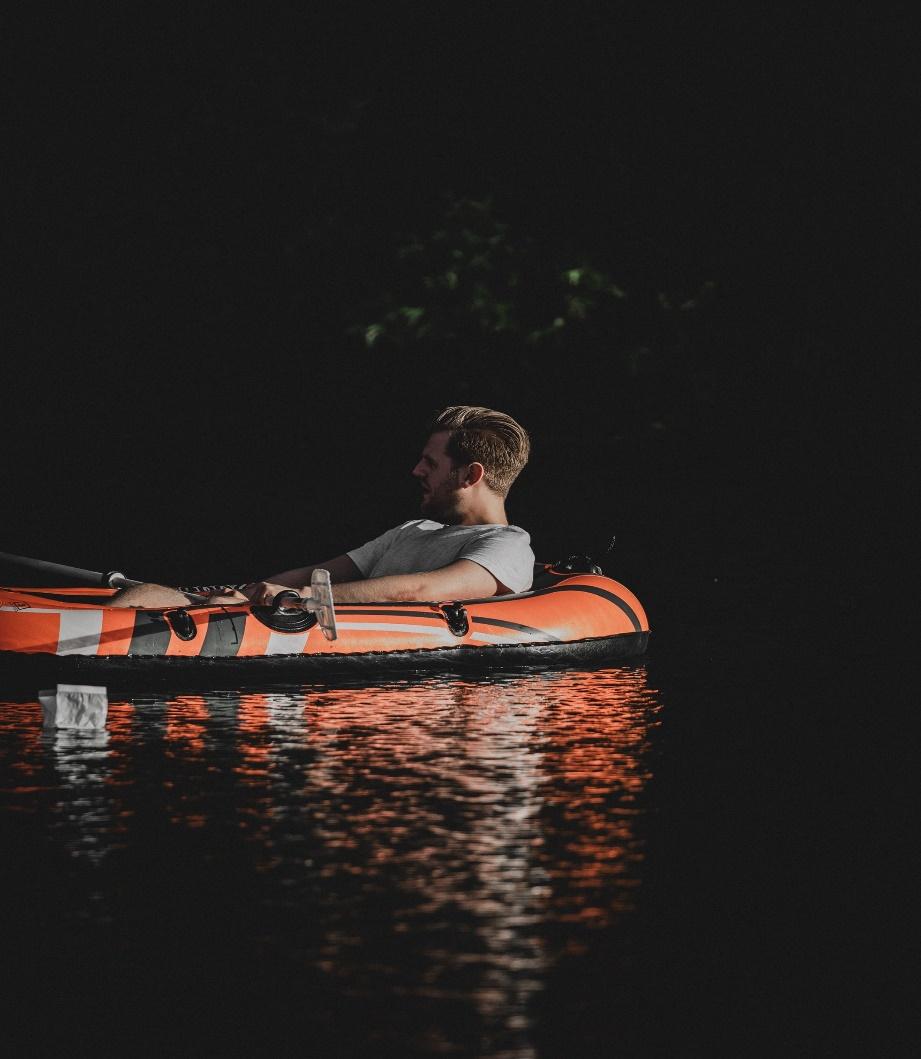 A person in a kayak at night
Description automatically generated with medium confidence