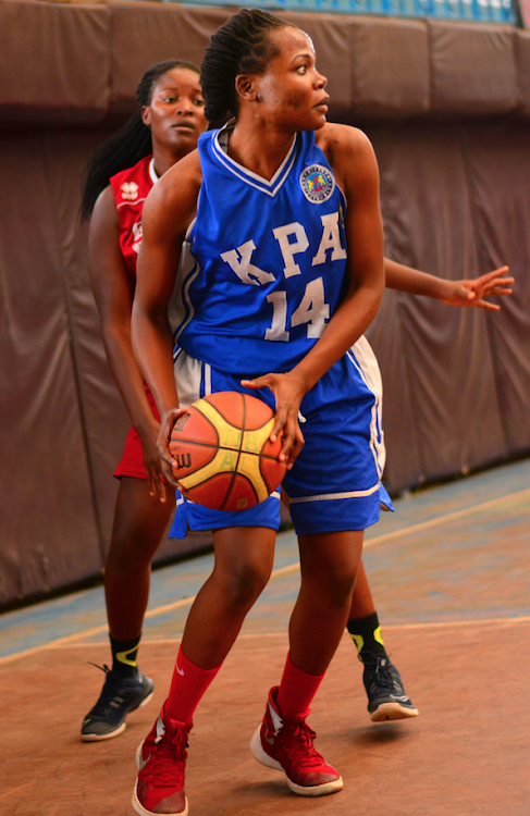 KPA's Selina Okumu shields the ball from Berine Okoth of Eagle Wings in a paast match