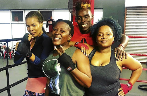 Actresses Connie Ferguson and Ramie Chuene and an unidentified actress with their trainer Xolisani 'Nomeva' Ndongeni.