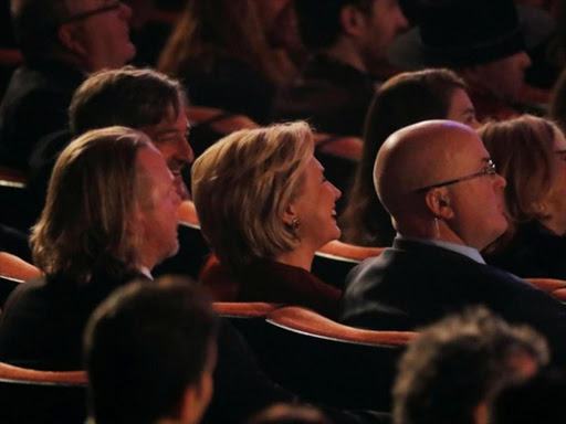 Former US Secretary of State and 2016 Democratic presidential nominee Hillary Clinton listens to her husband, former US President Bill Clinton speak during the 2018 MusiCares Person of the Year show honoring Fleetwood Mac at Radio City Music Hall in Manhattan, New York, US, January 26, 2018. /REUTERS