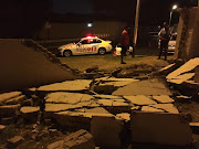 Paramedics on the scene of a crash where a car ploughed through a wall in Sandton