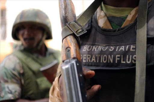 Nigerian soldiers of the "Operation Flush" stand in a military camp in Maiduguri capital of Borno state