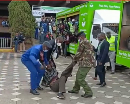 Man strong-armed by security officers after attempting to stage a protest during IEBC.