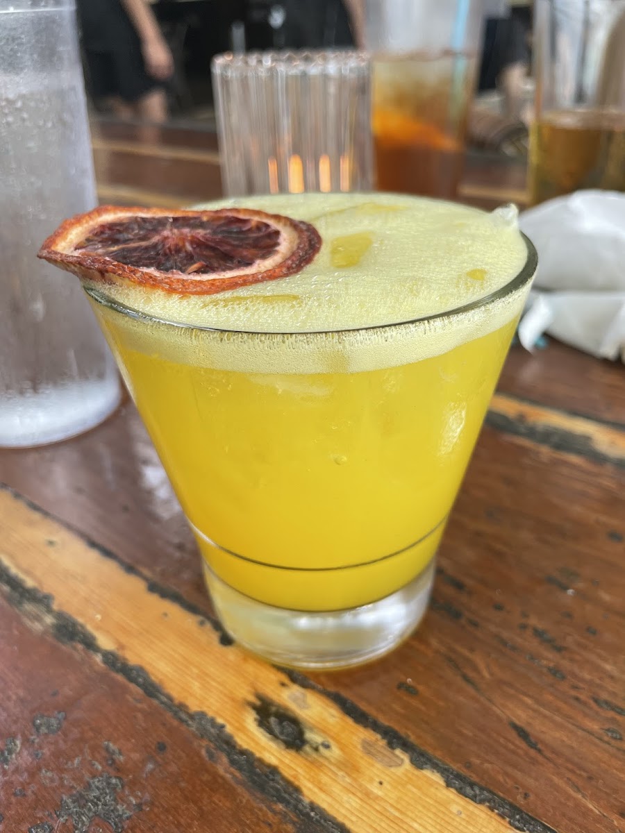 Titos, tumeric syrup, lime, and pineapple