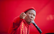 EFF leader Julius Malema told a rally in the Free State, 'We will not only fight [the police] at the picket lines. We will fight them in their homes, with their own families. We are not scared of the police.' 