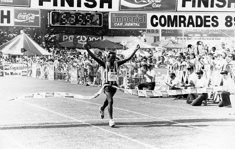 Samuel Tshabalala crosses the line in Durban to win the 1989 Comrades Marathon on May 31 1989. He was the first black person to win the race since the ban on their participation was lifted in 1975..