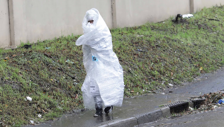 Bundled up against the cold in wet and windy Cape Town on Thursday.