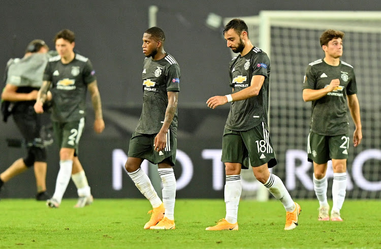 Dejected Manchester United players Fred and Bruno Fernandes after their Europa League semifinal loss to Sevilla at RheinEnergieSTADION, Cologne, Germany on August 16, 2020