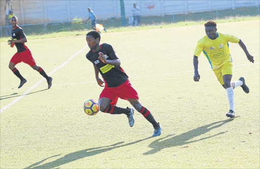 ON THE BALL: Abdul Sedu of Highbury FC give chase to Abongile Twani of Tornado FC during their league game in North End Stadium, in East London on Friday Picture: MICHAEL PINYANA