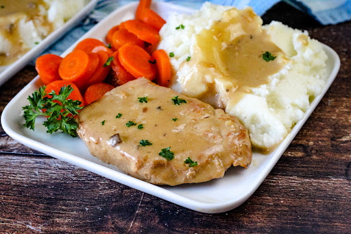 Delicious Pork Loin Chops (In a Crock Pot) on a plate.