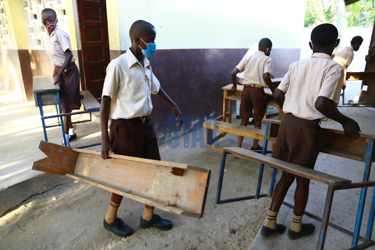 Kadzandani primary school students arrive at the school premises as school opens amid covid 19 pandemic.Photos / JOHN CHESOLI