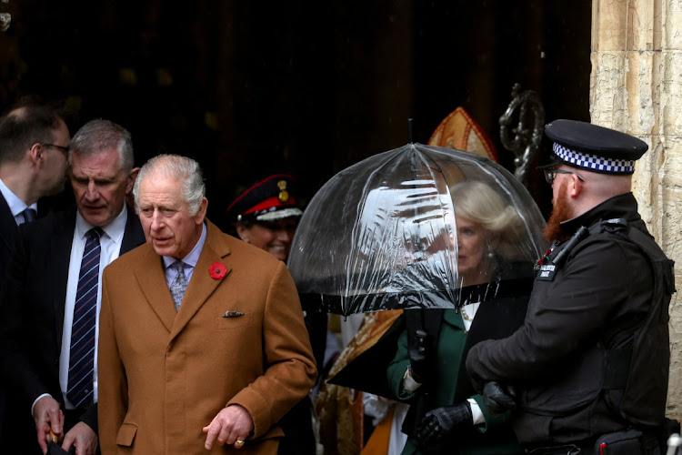 Britain's Queen Camilla holds an umbrella as she and King Charles visit York Minster cathedral in York, Britain November 9, 2022.