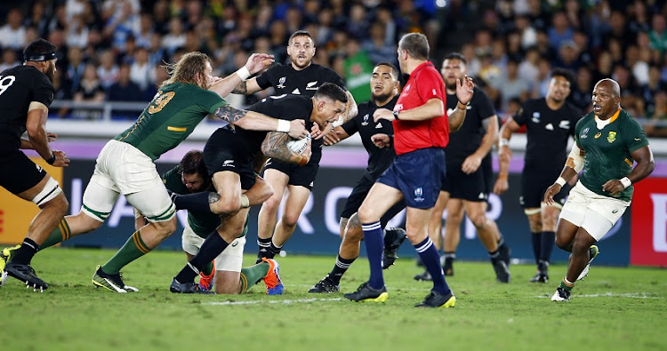 RG Snyman of South Africa looks to tackle Sonny Bill Williams of New Zealand (All Blacks) during the Rugby World Cup 2019 Pool B match between New Zealand and South Africa at International Stadium Yokohama on September 21, 2019 in Yokohama, Japan.