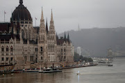 A police boat is seen on Danube river in front of the Hungarian parliament in Budapest, Hungary, on May 30 2019 after a tourist boat capsized, killing eight and leaving 21 people missing. 