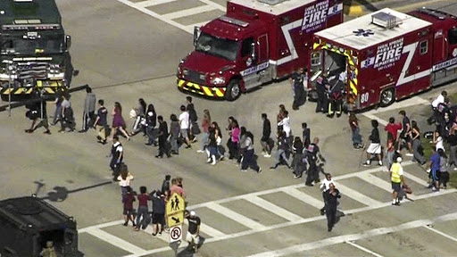 Students are evacuated from Marjory Stoneman Douglas High School in Parkland, Florida, during a shooting incident on February 14 2018, in this still image taken from video. Picture: WSVN.COM VIA REUTERS