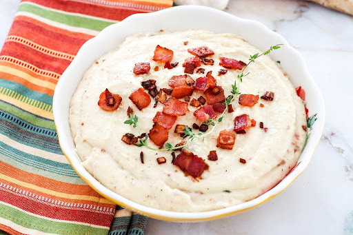 A bowl of Bacon Parmesan Parsnip Puree.