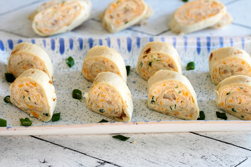 Sliced Crab Appetillas on a platter.