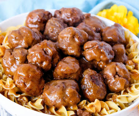 These Salisbury steak meatballs come out of the crockpot so moist and tender you'll never make them another way. Find out why I won a blue ribbon for them!