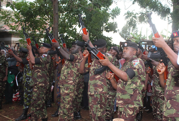 KDF officers give their colleague fallen KDF Sergeant Rose Nyawira Wachira a 21 gun salute during her burial in Kagio Thursday