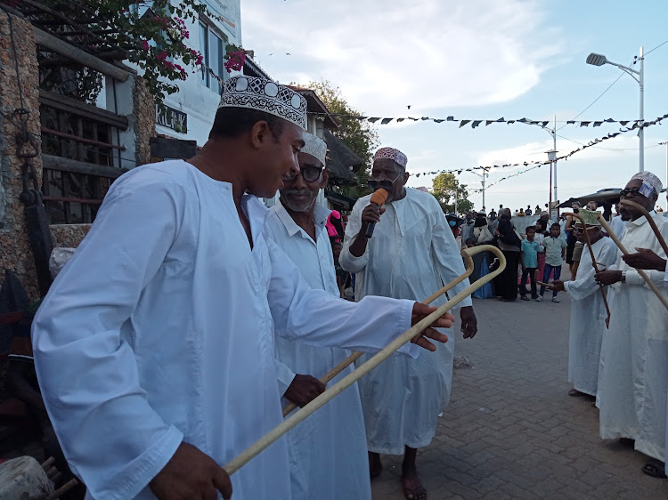 Men dance on the streets of Lamu island during the Maulid festival last year.