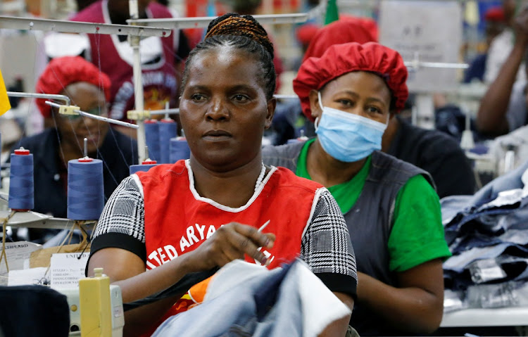 Norah Nasimiyu works on jeans for export at the United Aryan Export Processing Zone factory, operating under Agoa in the Ruaraka district of Nairobi. Picture: REUTERS/THOMAS MUKOYA